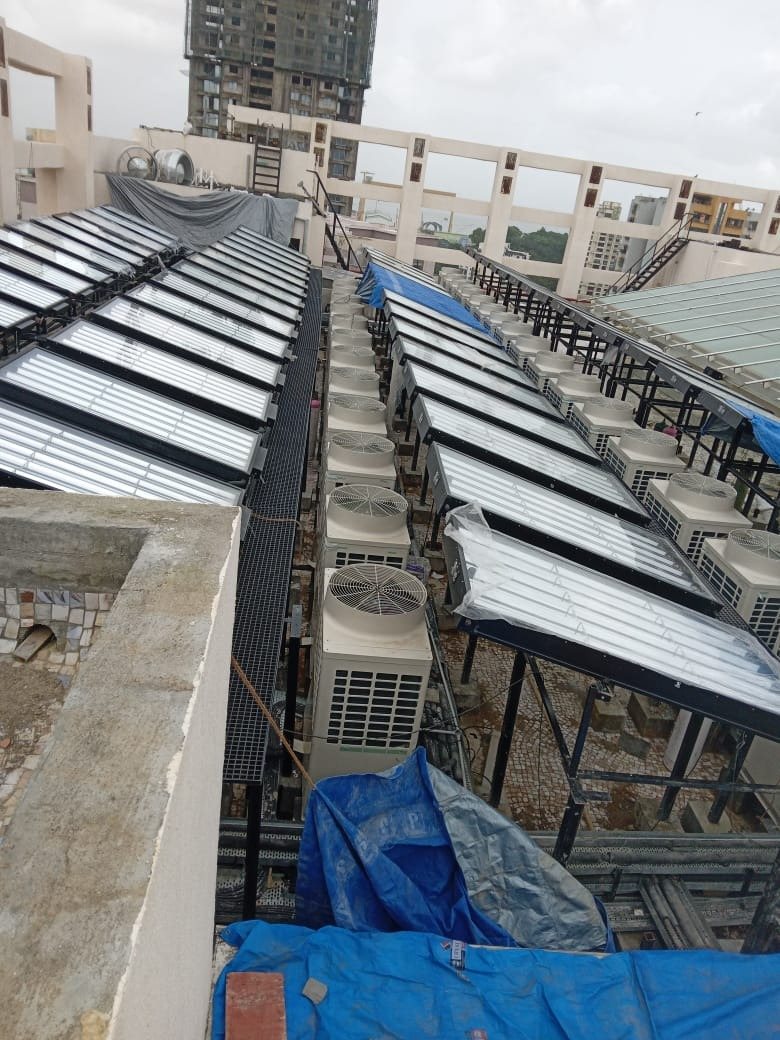 Rows of panels above VRF outdoor units at Mazgaon Metropolitan Court, Mumbai