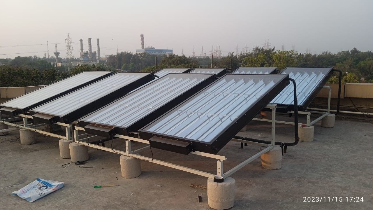 A row of HTS panels on an industrial rooftop