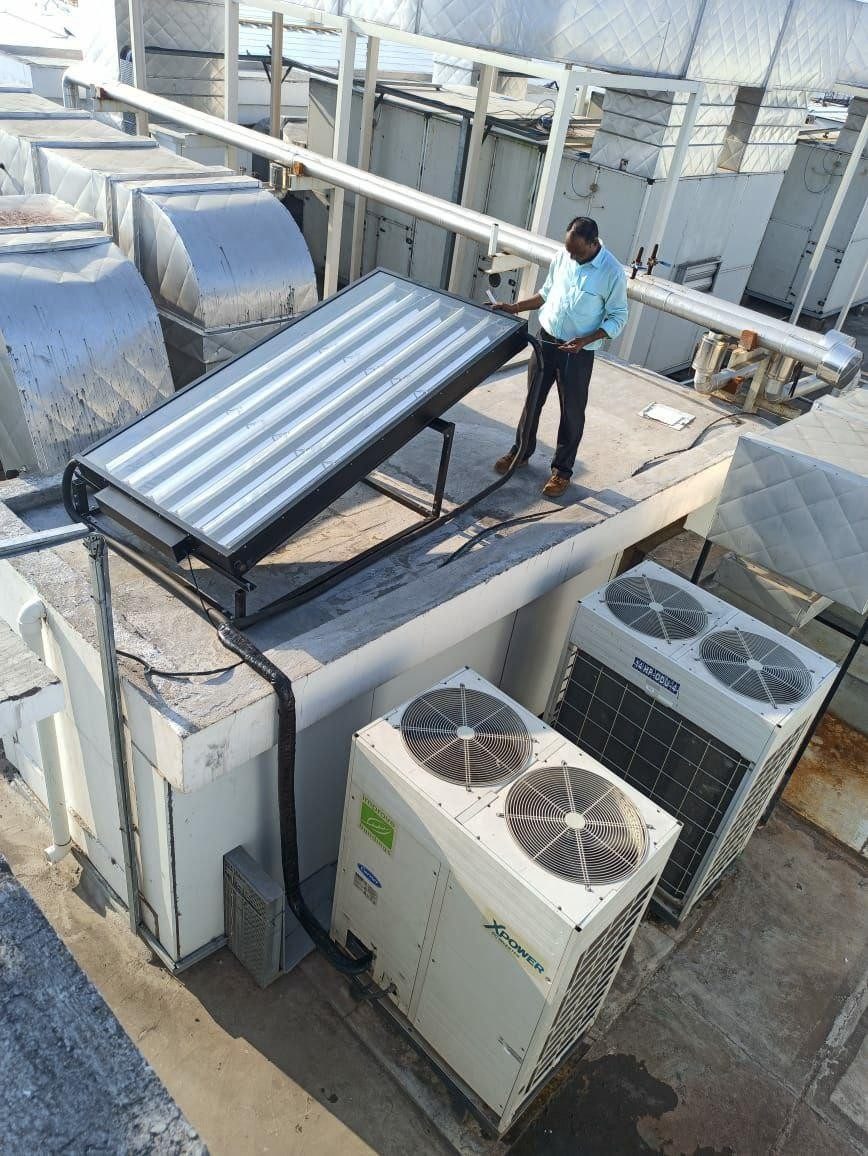 IESS panel mounted above VRF outdoor units on a rooftop